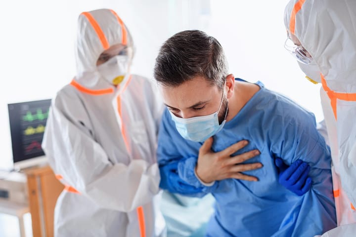 Medical staff in hazmat suits inside hospital isolation room during superbug outbreak